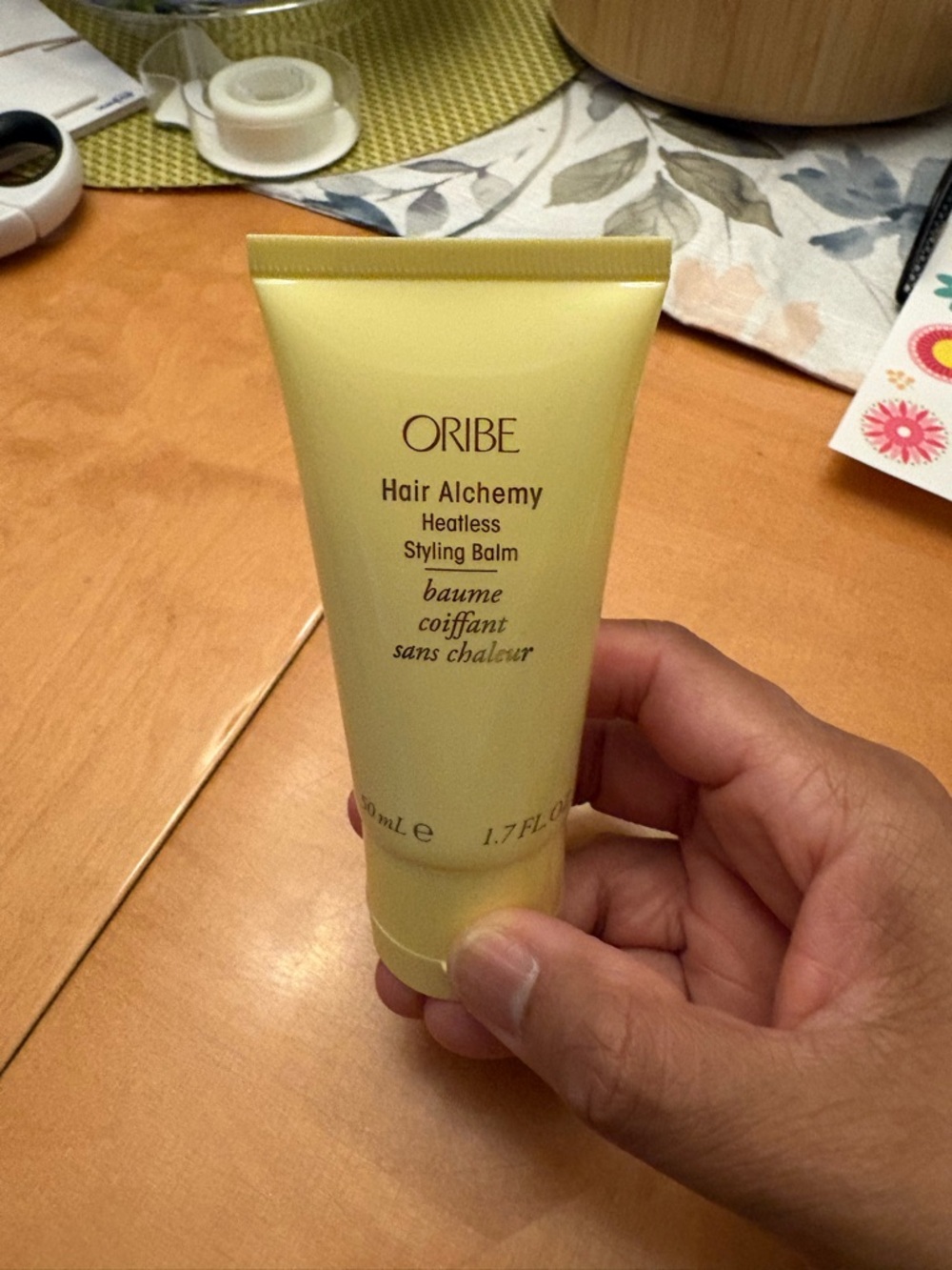 Oribe Hair Alchemy Heatless Styling Balm - Pale Yellow Tube